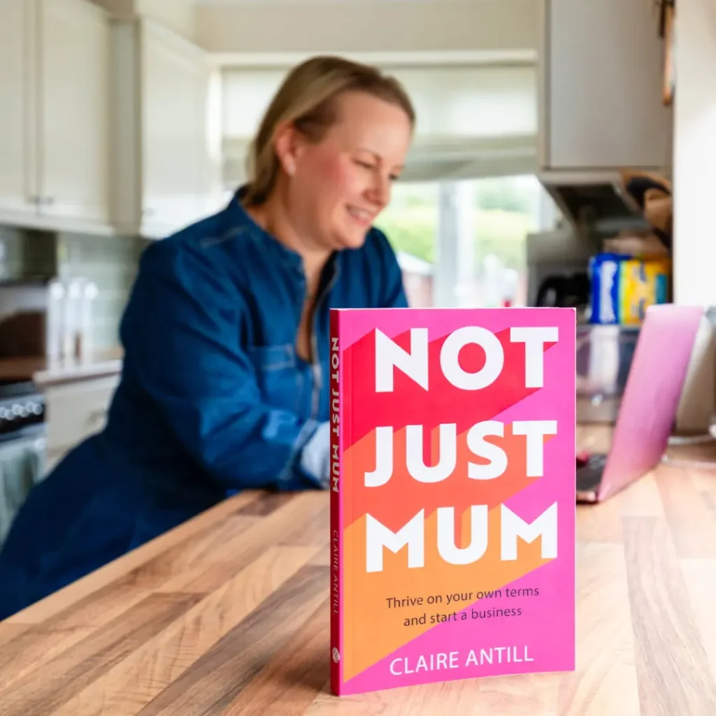 Claire reading in background, Not Just Mum book in foreground